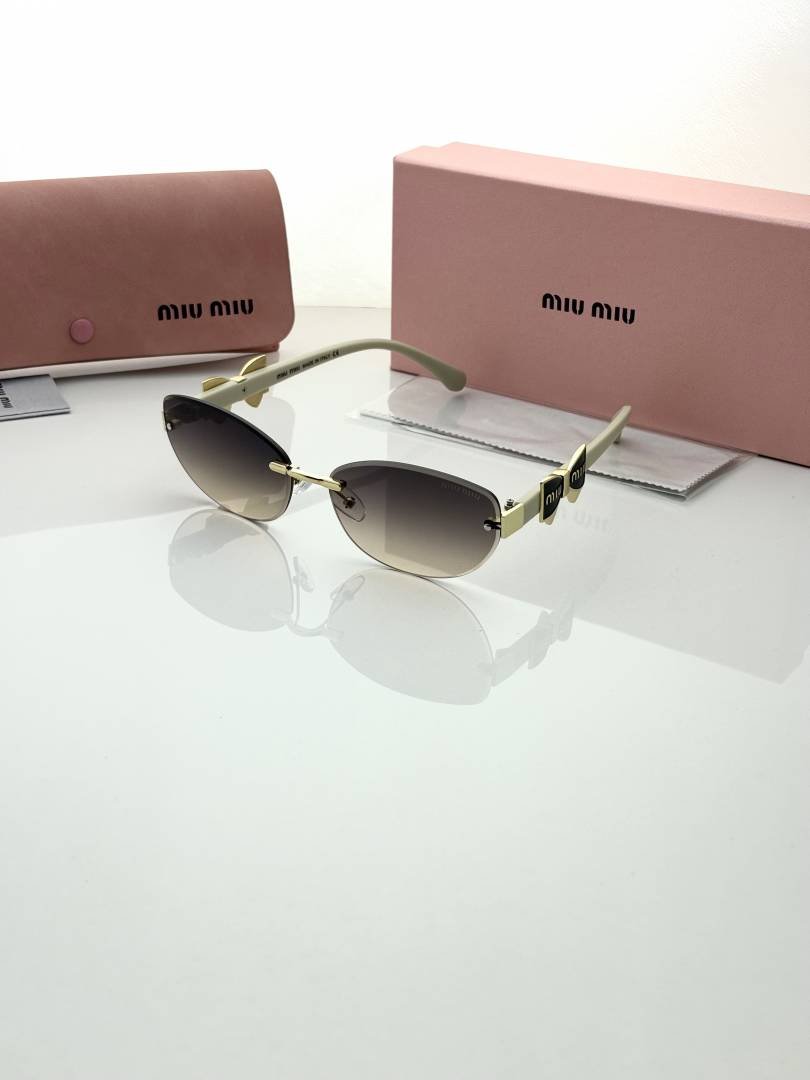 Miu.miu 26033 peach shaded