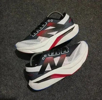 New Balance sc elite white black red