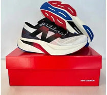 New Balance sc elite white black red