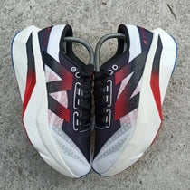 New Balance sc elite white black red